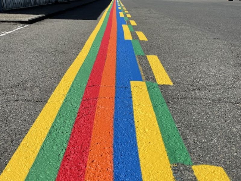 application peinture routière extérieure pulvérisation asphalte Belgique